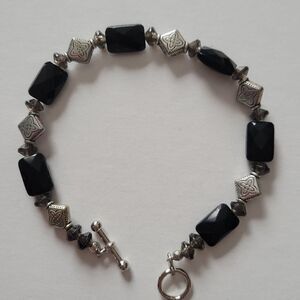 Artisan created bracelet and pierced earrings.